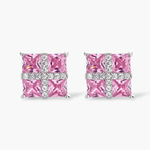 Square pink gemstone stud earrings with cross pattern of sparkling clear stones on white background