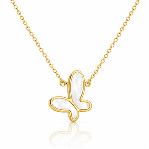 A delicate gold chain necklace featuring a butterfly-shaped pendant with a white mother-of-pearl inlay, set against a clean white background with a soft reflection below.