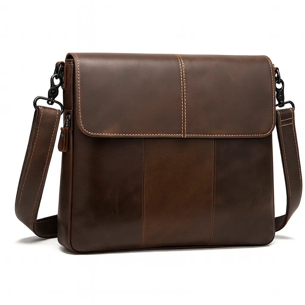 Archer unisex oil-wax leather crossbody messenger in coffee brown, worn across the body on a city street