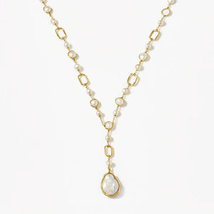 14K gold Y necklace with baroque pearl and oval links on white background