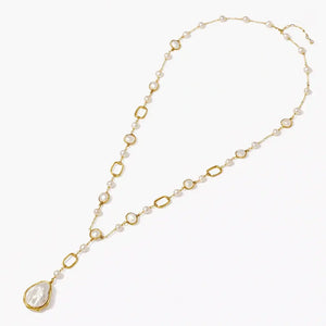 14K gold Y necklace with baroque pearl pendant and alternating pearls on white background