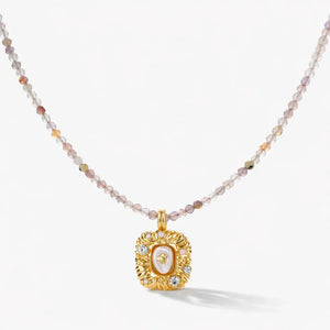 18K gold necklace with gemstone beaded chain and ornate square gemstone pendant