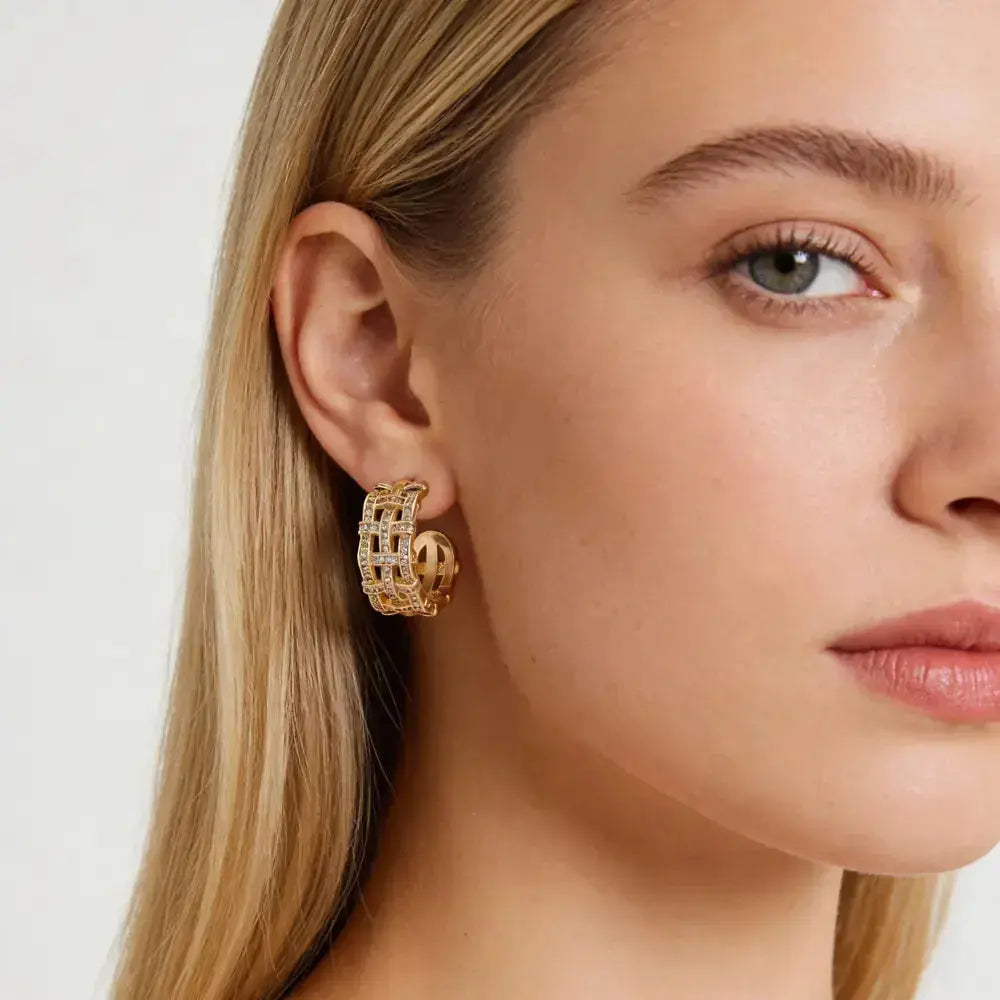 14k gold plated lattice hoop earring with sparkling stones on woman's ear