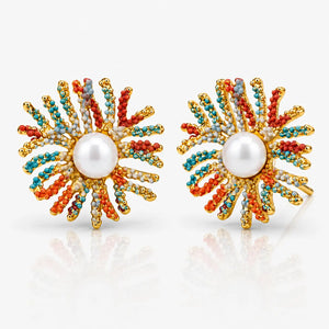 Pair of colorful beaded earrings with pearl center on a white background