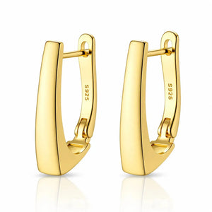 Gold hoop earrings on a white background