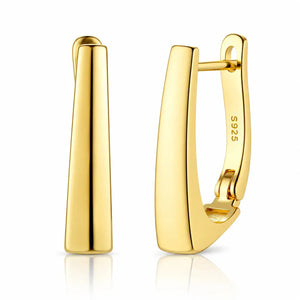 Gold hoop earrings on a white background