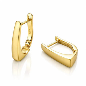 Gold hoop earrings on a white background