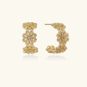 Gold hoop earrings on a white background
