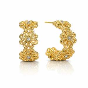 A pair of gold hoop earrings with intricate floral filigree detailing and small clear gemstones, displayed on a clean white background with a soft reflection.