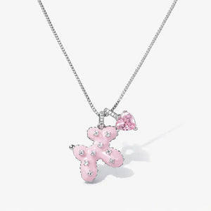 Silver chain necklace with pink teddy bear charm and pink heart gemstone pendant