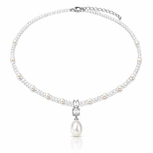 A silver-toned pearl necklace featuring a delicate chain of white pearls and clear cubic zirconia stones, with a central pendant showcasing a larger white pearl and a small rectangular clear stone, set against a plain white background.