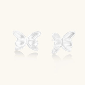 Butterfly-shaped earrings on a white background