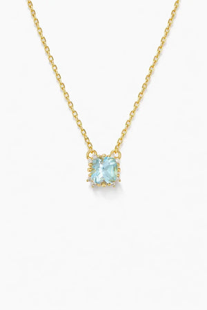 Gold plated necklace with a square blue gemstone pendant and small halo accents on a white background.