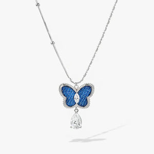 White gold necklace with blue butterfly pendant and sparkling crystal teardrop charm