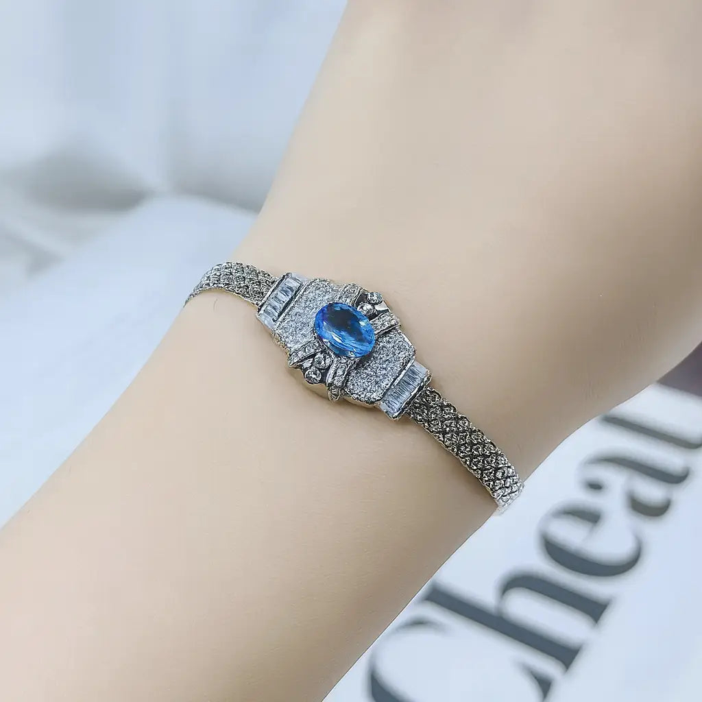 Celestia Sterling Silver Topaz Charm Bracelet with diamond-shaped design in 925 silver and topaz crystal inlay