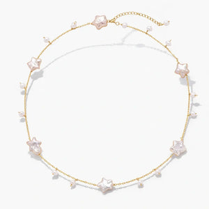 18K gold vermeil necklace with star-shaped pearls and small pearl accents on a white background