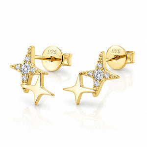 A pair of gold star-shaped stud earrings with clear cubic zirconia accents, shown on a clean white background with a soft reflection. The back of one earring is visible, showing a '925' sterling silver mark on the post.