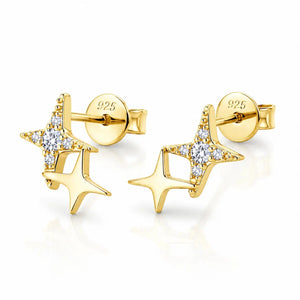 A pair of gold star-shaped stud earrings with clear cubic zirconia accents, shown on a clean white background with a soft reflection. The back of one earring is visible, showing a '925' sterling silver mark on the post.
