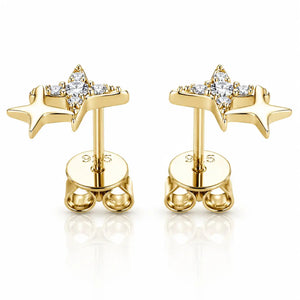 A pair of gold star-shaped stud earrings with clear gemstones, displayed on a clean white background with a soft reflection.