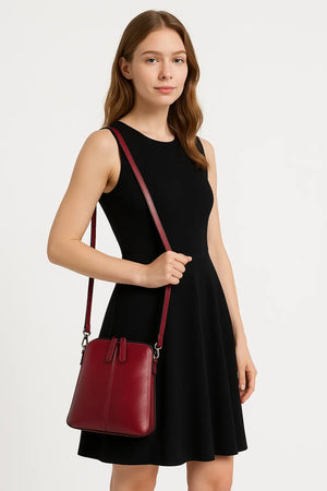 Chic Leather Shell Crossbody bag for women in genuine leather, compact 20cm size with adjustable strap and multiple color options.