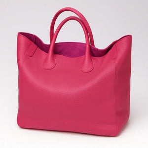 Black genuine leather super tote bag with large capacity, dual handles, and structured square shape – Chic Leather Super Tote.