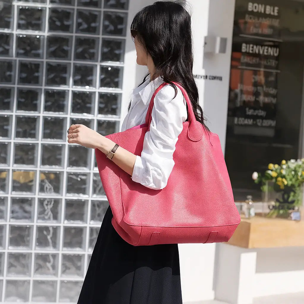 Black genuine leather super tote bag with large capacity, dual handles, and structured square shape – Chic Leather Super Tote.