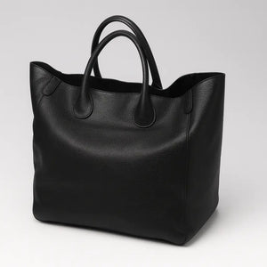 Black genuine leather super tote bag with large capacity, dual handles, and structured square shape – Chic Leather Super Tote.