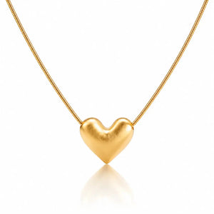 Gold heart-shaped pendant on a chain against a white background