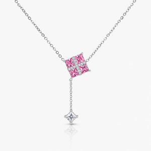 Necklace with a pink gemstone pendant on a white background
