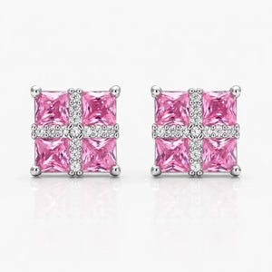 Pair of pink square gemstone earrings with silver accents on a white background