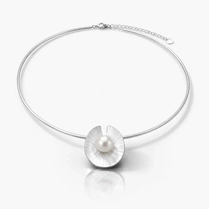 Silver necklace with a central pearl on a white background