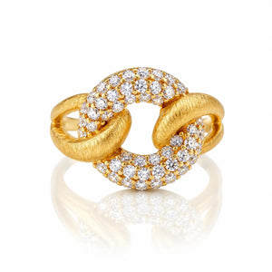 A gold ring with a knotted, interlocking design, featuring pavé-set round diamonds on the top and bottom curves. The ring is photographed on a clean white background with a soft reflection underneath.