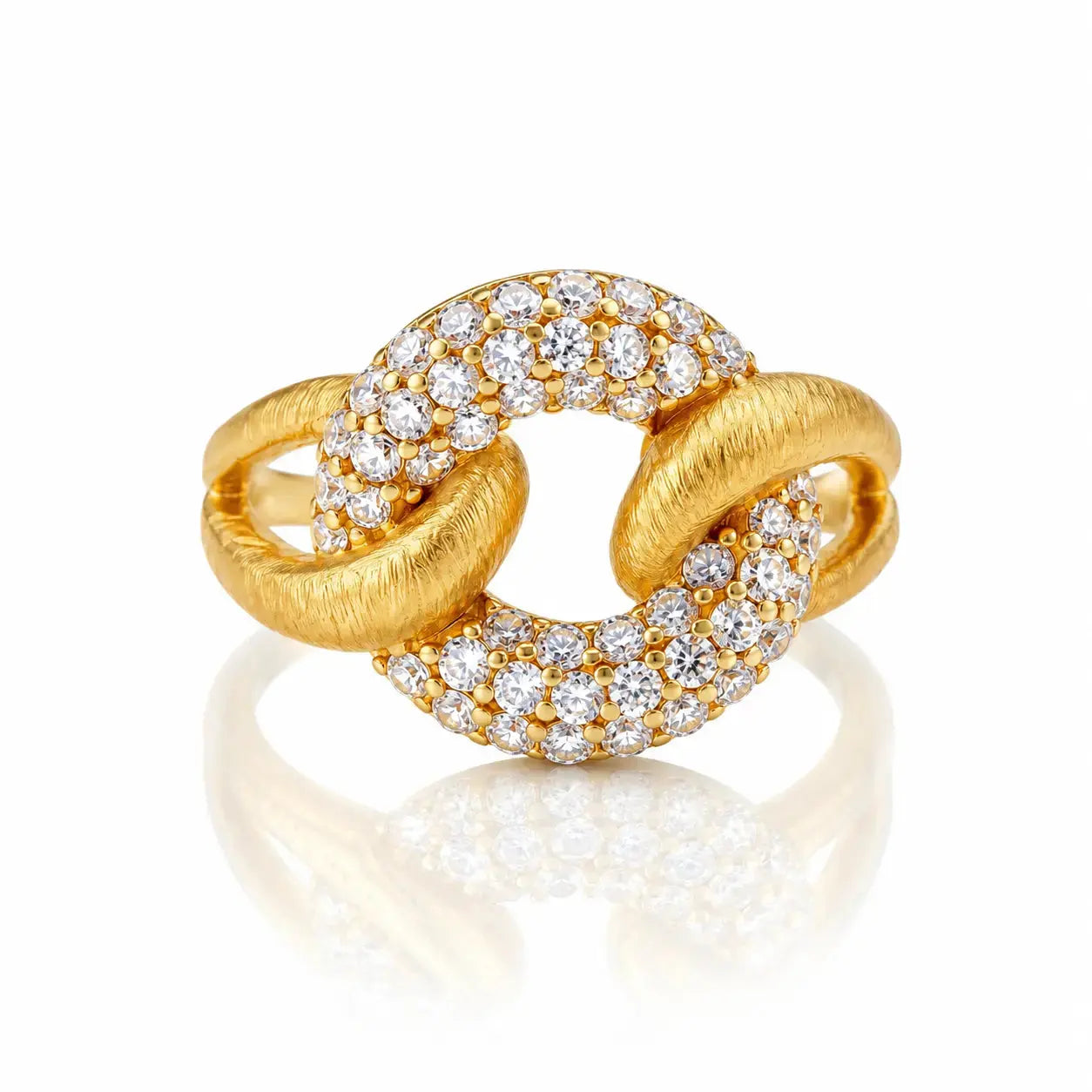 A gold ring with a knotted, interlocking design, featuring pavé-set round diamonds on the top and bottom curves. The ring is photographed on a clean white background with a soft reflection underneath.