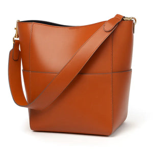 Elara womens genuine leather bucket tote in Black, Earth Yellow, Olive Green, and White with magnetic buckle and inner pocket (330×330×120 mm).