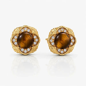 Pair of gold earrings with tiger's eye stones on a white background