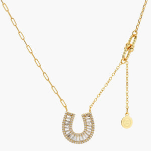 Gold horseshoe pendant necklace with clear baguette crystals and adjustable chain