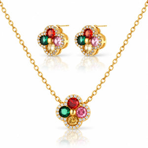 Gold-tone necklace and matching stud earrings set with four flower-shaped clusters of colored gemstones and small clear accent stones, shown on a white background with reflections.