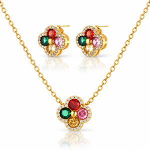 Gold-tone necklace and matching stud earrings set with four flower-shaped clusters of colored gemstones and small clear accent stones, shown on a white background with reflections.