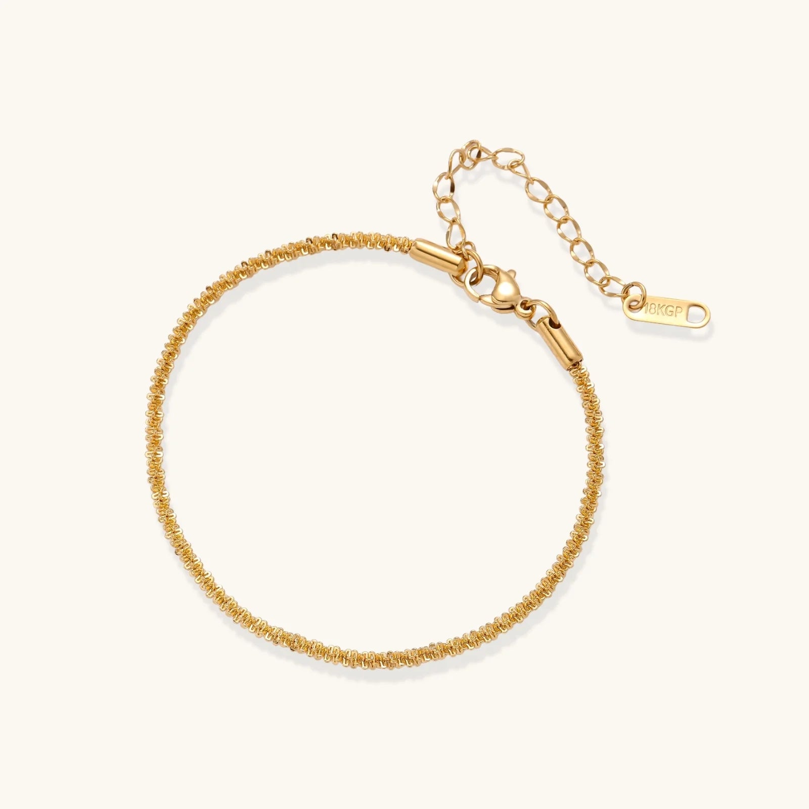 Gold bracelet on a white background