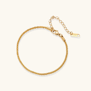 Gold bracelet on a white background