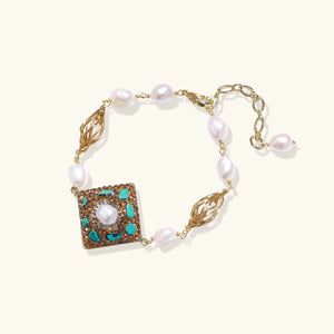 Jewelry bracelet with pearls and decorative square element on a white background