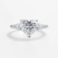 S925 sterling silver heart halo ring with 8×8 mm heart-cut high-carbon center and micro-pavé accents (HeartLuxe).