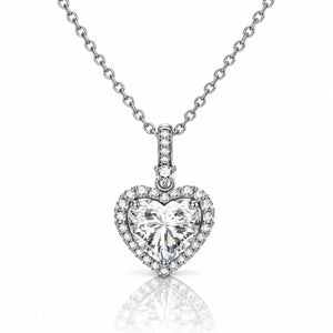 A heart-shaped diamond pendant necklace on a silver chain, set against a clean white background with a soft reflection below.