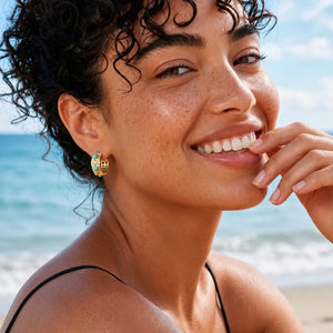 Woman with freckles smiling on a beach