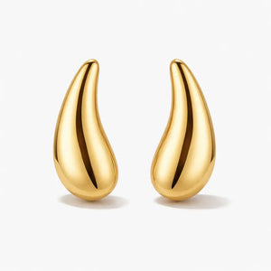 Pair of polished gold teardrop stud earrings on a white background