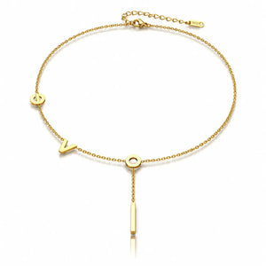 Gold bracelet with letter 'Y' and bar design on a white background