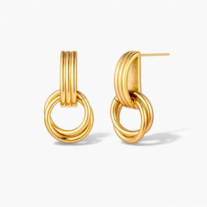 18K gold plated linear loop earrings with interlocking circular design on white background