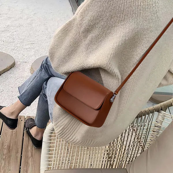 Liora niche design genuine leather crossbody bag in black and brown with multiple carrying options – by Jewellar