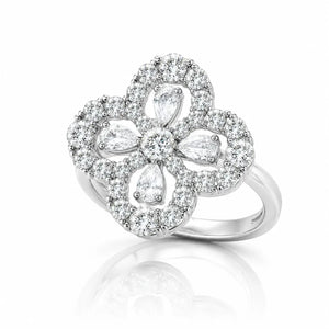 A silver-tone flower ring featuring multiple clear gemstones, including marquise and round cuts, set against a clean white background with a soft reflection below.