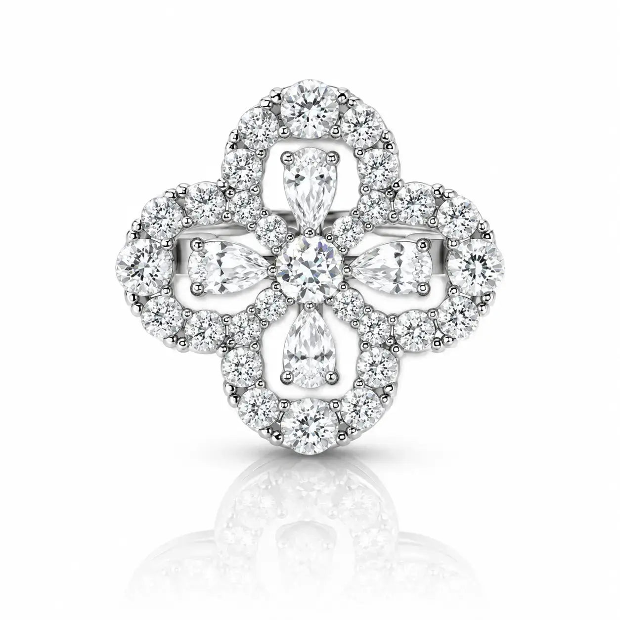 A silver-toned clover-shaped halo ring set with round and marquise-cut clear diamonds, centered on a white background with a soft reflection below.